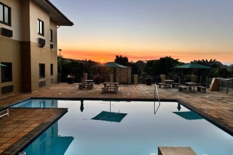 Hampshire hotel blue swimming pool with beautiful sunset