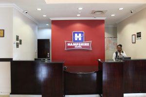 Hampshire hotel front desk with receptionist assisting clients on the telephone